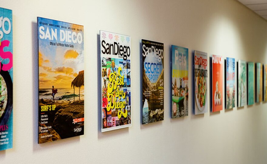 Images of San Diego Magazine covers hang on the wall in this undated photo.