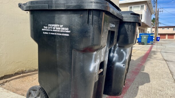 Trash bins stand in an alley in Ocean Beach, Sept. 17, 2025.