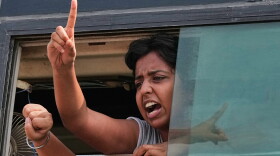 A protester shout slogans as they are detained and taken in a police vehicle during a protest demanding the resignation of Chief Election Commissioner Gyanesh Kumar in New Delhi, India, Saturday, Oct. 10, 2026.