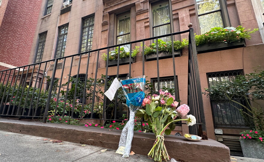 Flowers rest outside of Gloria Steinem's Manhattan apartment on Thursday.