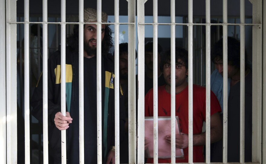Jailed Taliban are seen inside the Pul-e-Charkhi prison in Kabul in December. Prisoner release is a key pillar of the U.S.-Taliban agreement.