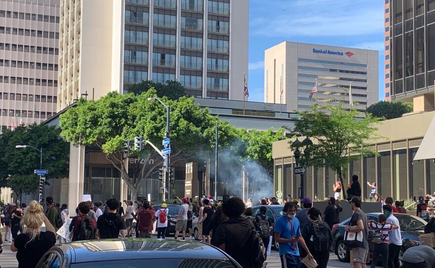 Tear gas canister explodes in a crowd of protesters during a demonstration in downtown San Diego, May 31, 2020.