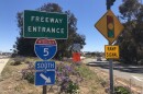 A car drives onto the onramp for the I-5 south at the Palomar Airport Road exit, March 23, 2022.