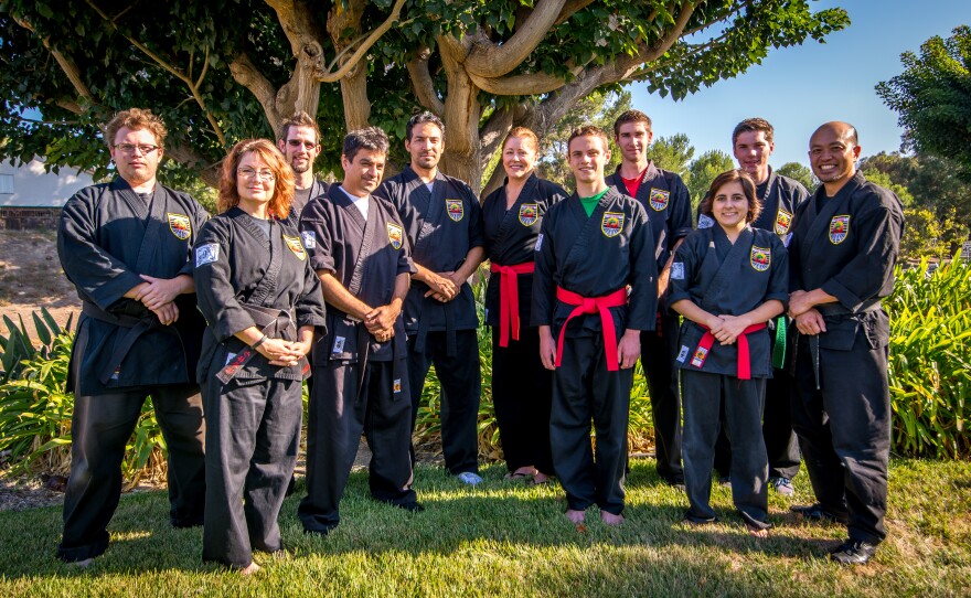 Hoang pictured with martial arts instructors from the USSD Team Focus organization.