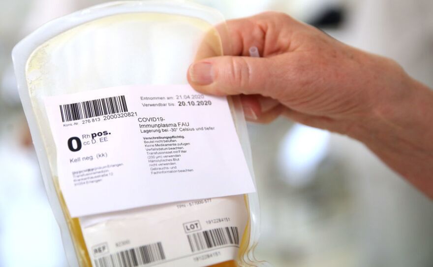 A researcher at the German Center for Immunity Therapy holds a bag containing blood plasma from a recovered COVID-19 patient at the University Hospital Erlangen on April 27, 2020 in Erlangen, Germany. This plasma could be used to treat people with COVID-19.