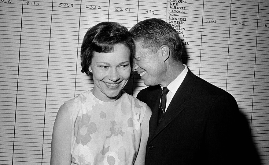 Georgia state Sen. Jimmy Carter hugs his wife, Rosalynn, at his Atlanta campaign headquarters in 1966.
