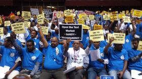 Proponents of lifting the cap in taxi permits in the city of San Diego show their support at a San Diego City Council meeting, Nov. 10, 2014. The meeting was held in Golden Hall to accommodate the large crowed expected. 