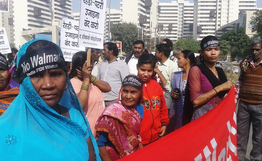 Protesters gather outside Wal-Mart's India offices in Gurgaon. Their demand: Wal-Mart should build its stores far from markets where they work.