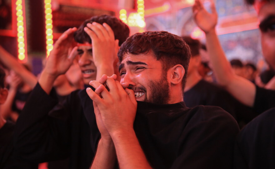 A young pilgrim weeps as he takes part in mourning rituals inside the Imam Hussein Shrine in Karbala during the Arbaeen commemoration.