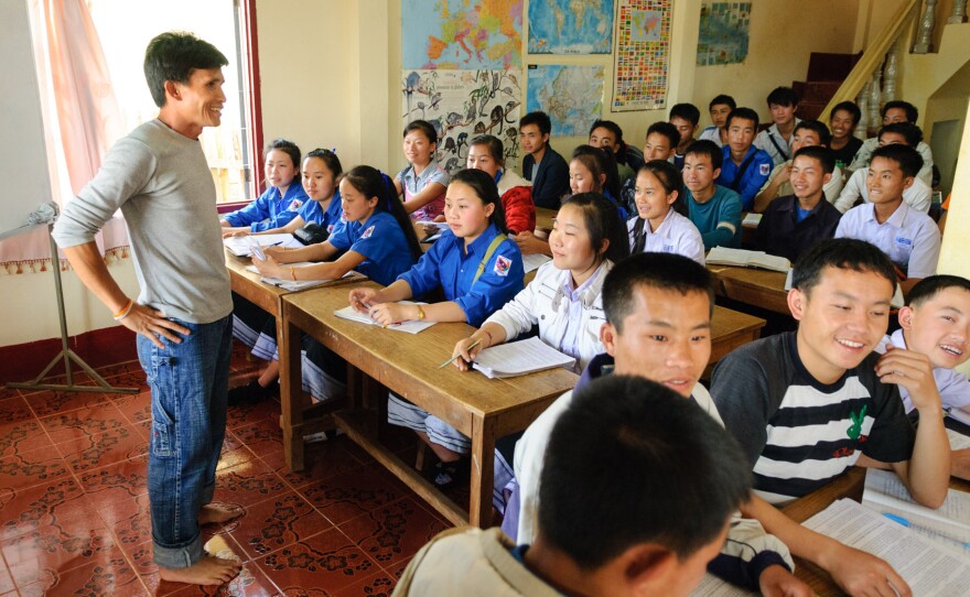 Manophet talks with an English language class at the school he set up in a house on the outskirts of Phonsavan, Laos.