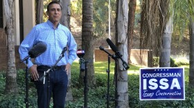 Darrell Issa speaks to reporters outside of his Vista campaign office in this photo taken Nov. 4, 2020.