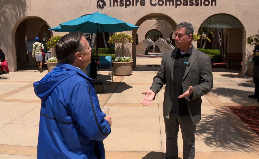 San Diego Humane Society President & CEO Dr. Gary Weitzman is shown being interviewed by KPBS reporter John Carroll on May 5, 2026.