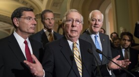 Senate Majority Leader Mitch McConnell of Ky., joined by, from left, Sen. John Barrasso, R-Wyo., Sen. John Thune, R-S.D., and Senate Majority Whip John Cornyn of Texas, speaks with reporters on Capitol Hill in Washington, July 25, 2017. 