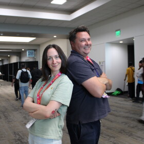 Mallory Rubin (left), the director of content at the Ringer and co-host of the podcast "House of R" poses with KPBS Roundtable host Andrew Bracken in the hallway of the San Diego Convention Center, Thursday, July 23, 2026.