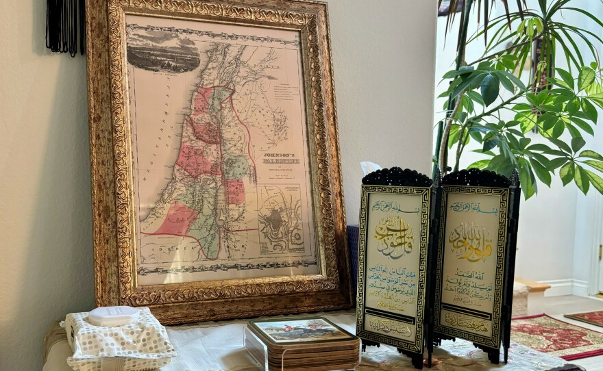 A map that includes Gaza and describes the region as Palestine sits in Hedab Tarifi's living room.