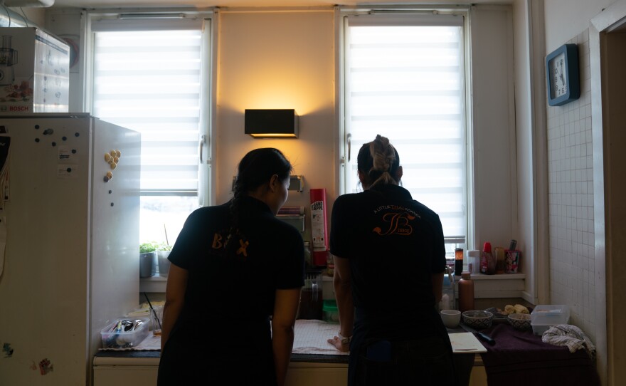 Paprajong's daughters work together in the restaurant.