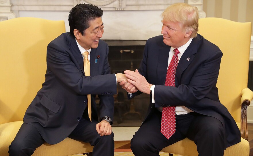 President Donald Trump and Prime Minister Shinzo Abe pose for photographs before bilateral meetings in the Oval Office at the White House, Feb. 10, 2017, in Washington, D.C.