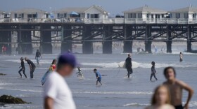 People play at the beach ahead of Memorial Day weekend Friday, May 28, 2021, in San Diego. 