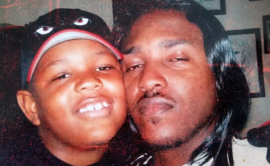 James Carter poses with his son in an old family photo.