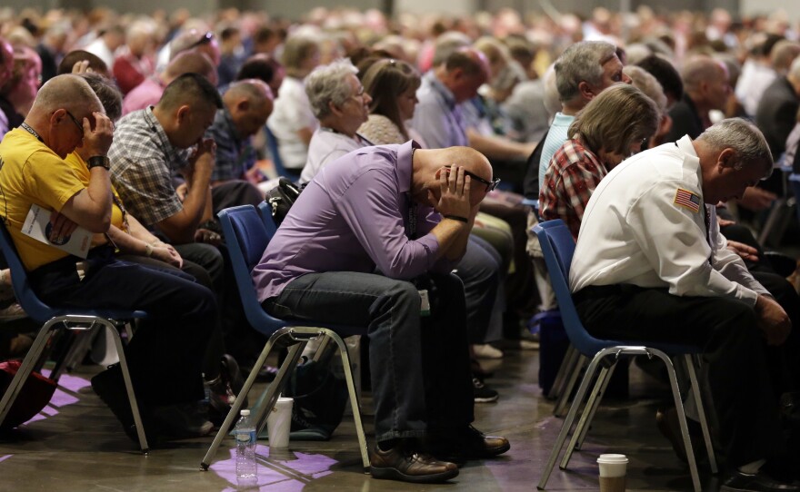 Delegates at prayer during the annual meeting of the Southern Baptist Convention in St. Louis.