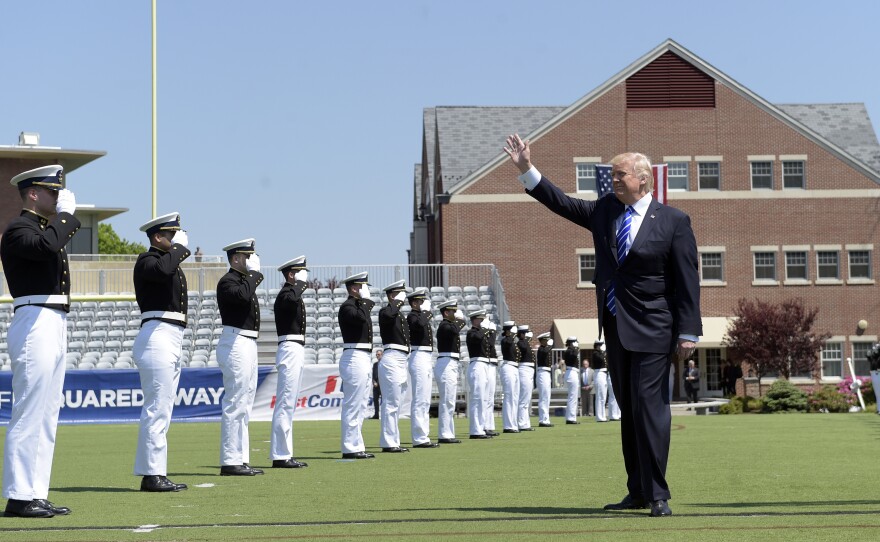 President Trump waves as he arrives to give the commencement address at the U.S. Coast Guard Academy on Wednesday.