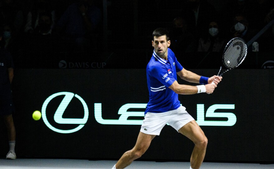 Novak Djokovic of Serbia plays a backhand against Marin Cilic of Croatia during the Davis Cup Semi Final match between Croatia and Serbia at Madrid Arena pavilion in December in Madrid, Spain.
