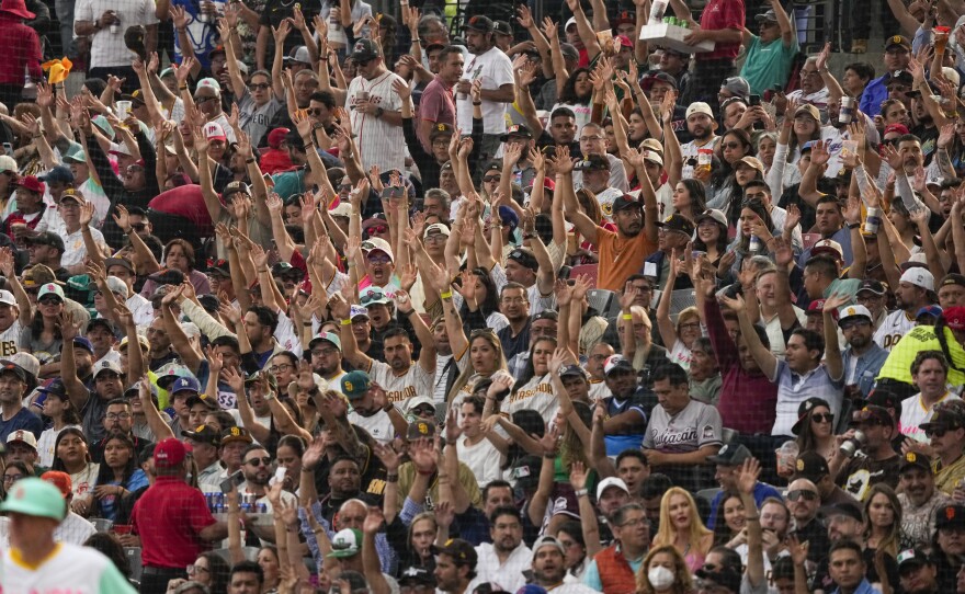Fans cheer during an MLB baseball game between the San Diego Padres and San Francisco Giants, at the Alfredo Harp Helu Stadium in Mexico City, Saturday, April 29, 2023.