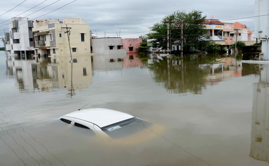 Submerged cars and stalled mass transport have left thousands of residents stranded in Chennai.