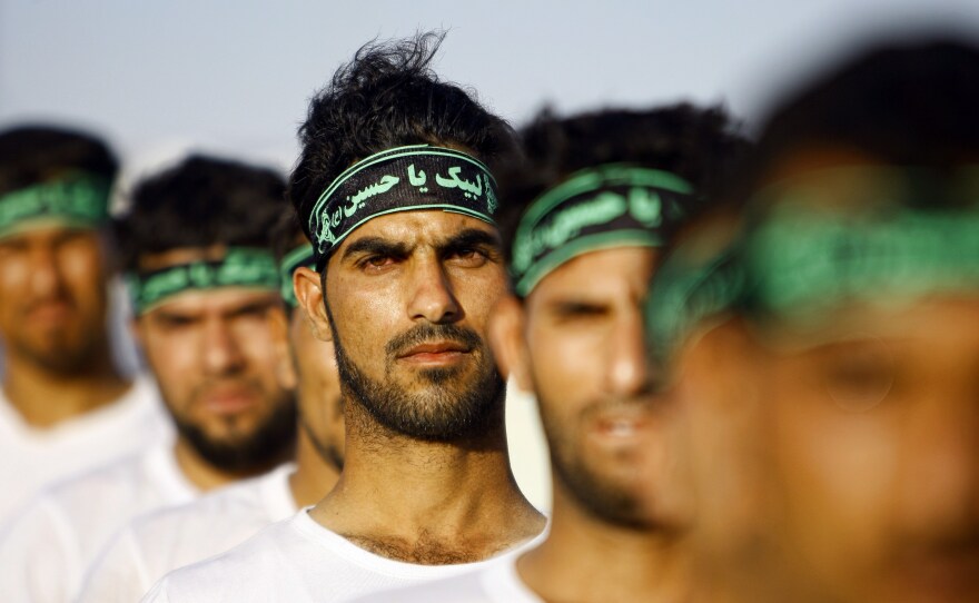 Iraqi Shiite volunteers with the Labayk ya Hussein Brigade take part in a training session in the holy city of Najaf in late June. Clerics in the city called for Shiites to step forward and fight the Sunni group formerly known as the Islamic State of Iraq and Syria (which now calls itself simply the Islamic State).