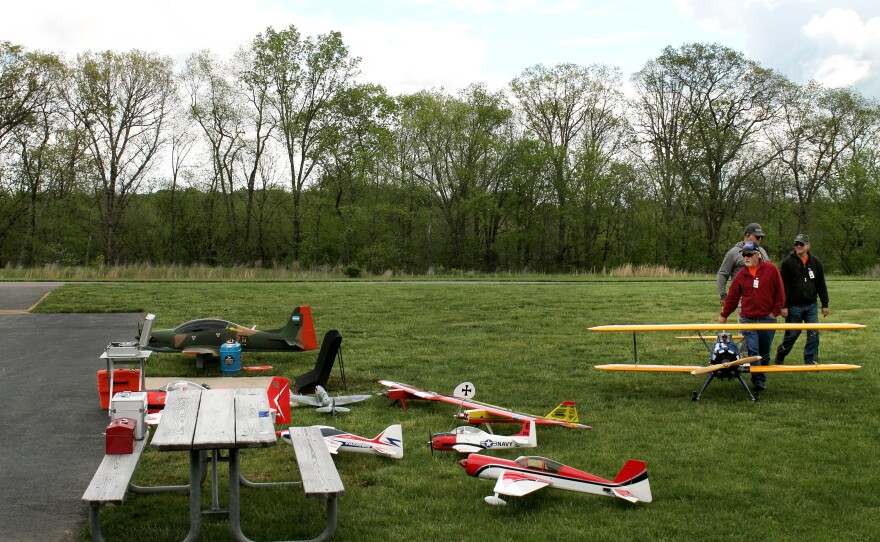 Model airplanes cluster near the runway on a flying field in Boyds, Md.