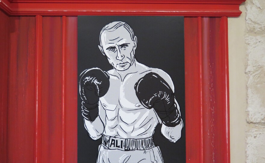 Putin was also depicted as Muhammad Ali.