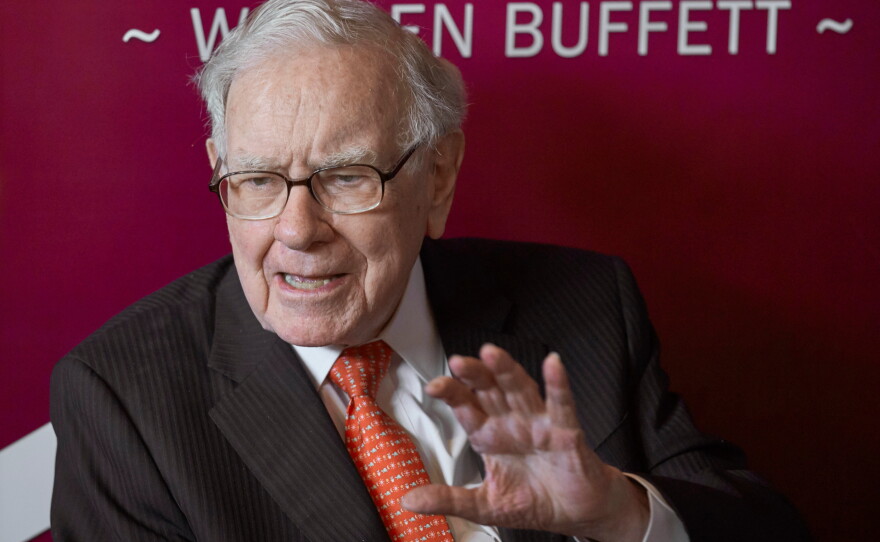 FILE - Warren Buffett, chairman and CEO of Berkshire Hathaway, speaks during a game of bridge following the annual Berkshire Hathaway shareholders meeting May 5, 2019, in Omaha, Neb.
