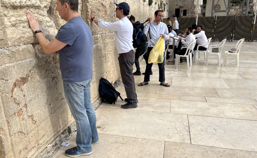 Ahmed Quraishi (second from left), a Pakistani TV news anchor, stands at the Western Wall prayer site in Jerusalem in May. His participation in the rare Pakistani visit sparked a backlash back home, prompting Pakistani state-run TV to fire him.