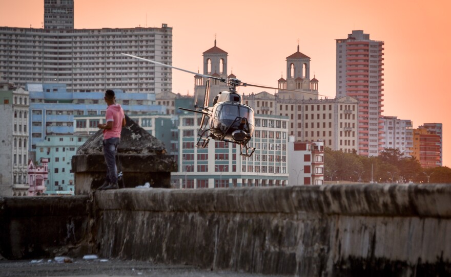 A helicopter from Universal Studios of Hollywood flies above Havana during the shooting of <em>The Fate of the Furious</em> on April 28, 2016.