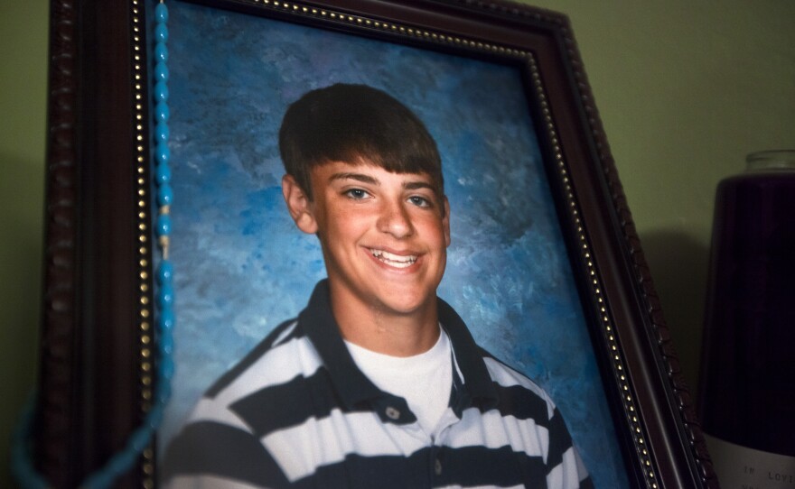 Whitebread was 14 when he was sucked under the corn in the grain bin just down the street from his family's home in Mount Carroll. This photo sits atop a makeshift shrine in a corner of the home.