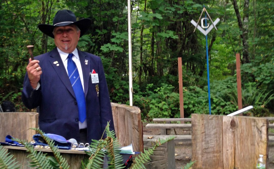 Sam Roberts, most worshipful grand master of Washington State, presides over an outdoor ceremony. His wife, Vicky, says she doesn't mind that women can't participate in the Masons' ceremonies.