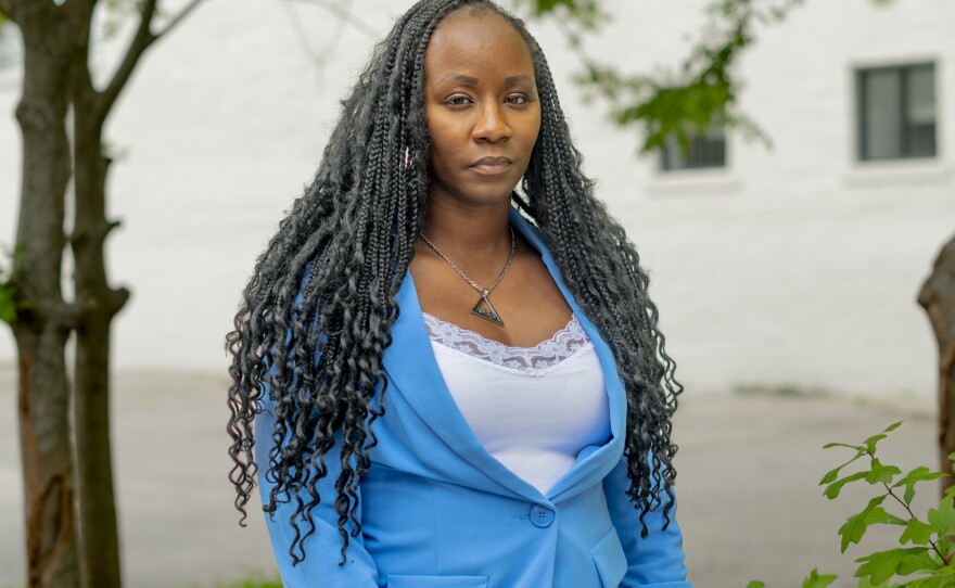 Shalela Dowdy, a plaintiff in a lawsuit challenging Alabama's congressional districts, poses for a portrait on Government Street in Mobile, Ala., on April 1.