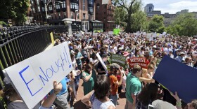 People rally outside the Statehouse, in Boston, Wednesday, June 20, 2018 to protest how immigrants are being treated both on the border with Mexico and in Massachusetts.