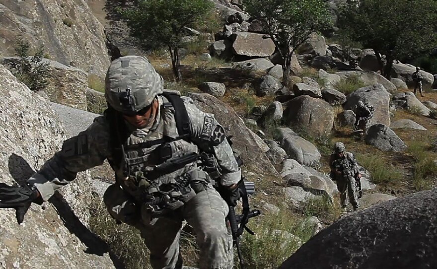 U.S. Army Staff Sgt. Rande Henderson makes his way through a ravine filled with boulders while on patrol with 2nd Platoon, Charlie Company, 1st Battalion, 17th Infantry Regiment of the 5th Stryker Brigade in Afghanistan's Kandahar province.