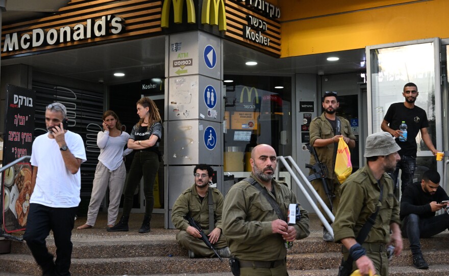 Israeli soldiers and civilians at the gas station and kosher McDonald's in Beit Kama Junction, near Sderot, Israel.