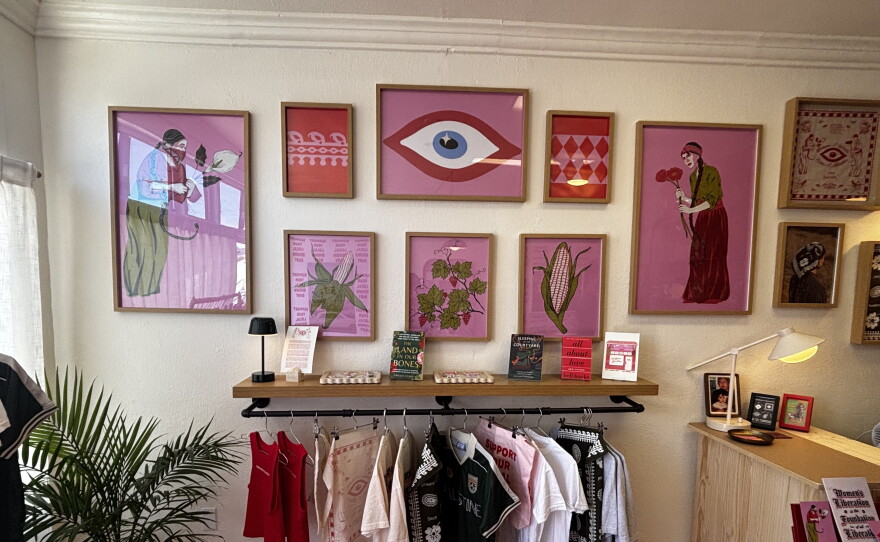 Art and clothing created by Jiyan Rios Zandi inside of her store, Local Brown Baby on July 9th, 2026.