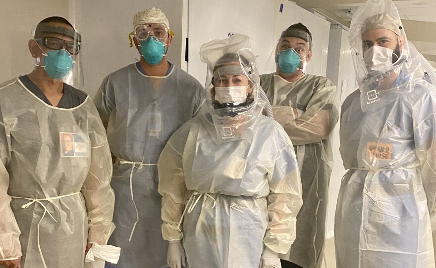 Brittany Goyette and her colleagues at Sharp Chula Vista Medical Center wear personal protective equipment in the hospital's intensive care unit, Oct. 23, 2020.