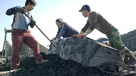 A coal mining brigade unloads a cart full of coal that has been freshly mined from half-a-mile below the surface of the earth. For some rural Mongolians, risking their lives in crude, makeshift mines is the only way to survive.