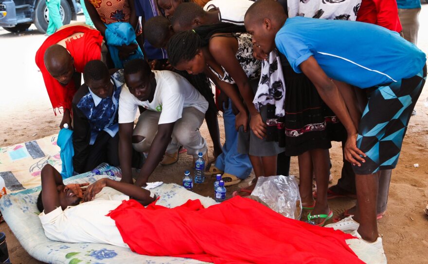 A survivor of the Garissa University attack talks to fellow students one day after gunmen attacked the university. The government says 147 people were killed.