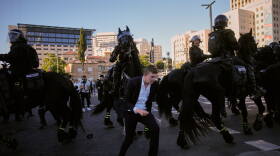 Israeli mounted police disperse Ultra-Orthodox Jews blocking a road during a protest against army draft in Jerusalem, Monday, June 1, 2026.