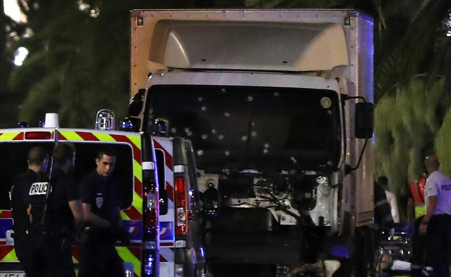 The former mayor of the French city of Nice said dozens of people were killed in the attack Thursday. He urged residents to stay indoors.