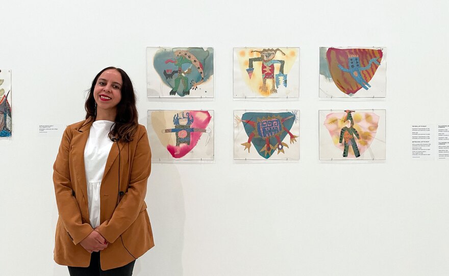 Artist Griselda Rosas is shown with a series of untitled artworks inspired by her son's drawings, on display at the Museum of Contemporary Art San Diego in La Jolla on March 14, 2023.