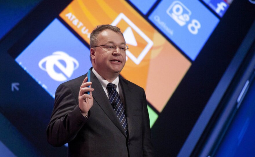 Nokia President and CEO Stephen Elop introduces the Lumia 900 smartphone during a CES news conference in Las Vegas.