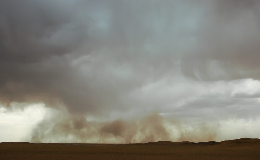 A sandstorm moves the Gobi desert in Mongolia.