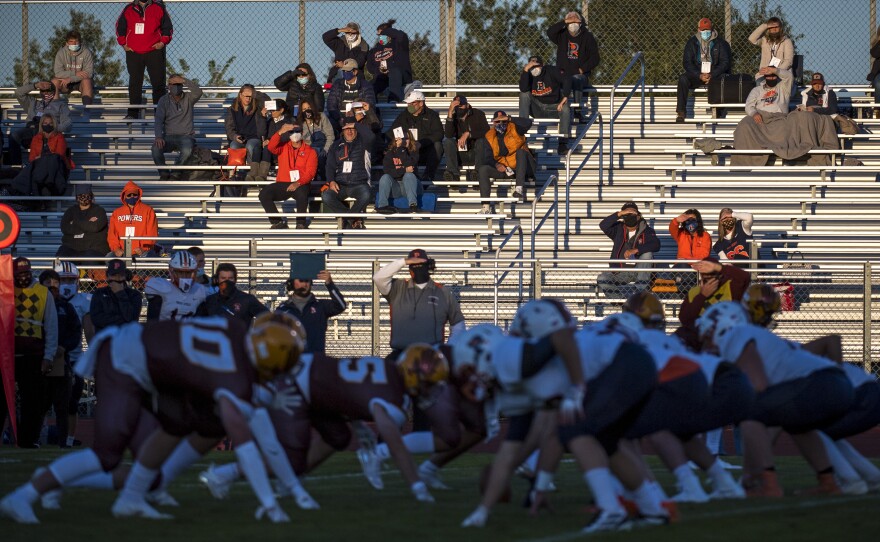 Fans watch the high school football game between Davison and Flint Powers Catholic on September 18, 2020 in Davison, Michigan.